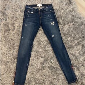 Designer jeans size 26 with red zipper on ankles